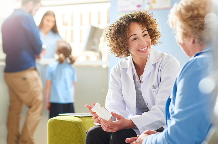 Pharamacist talking to her patient
