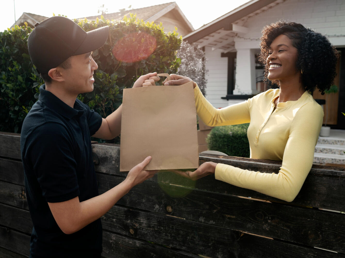 A woman taking prescription delivery from her door