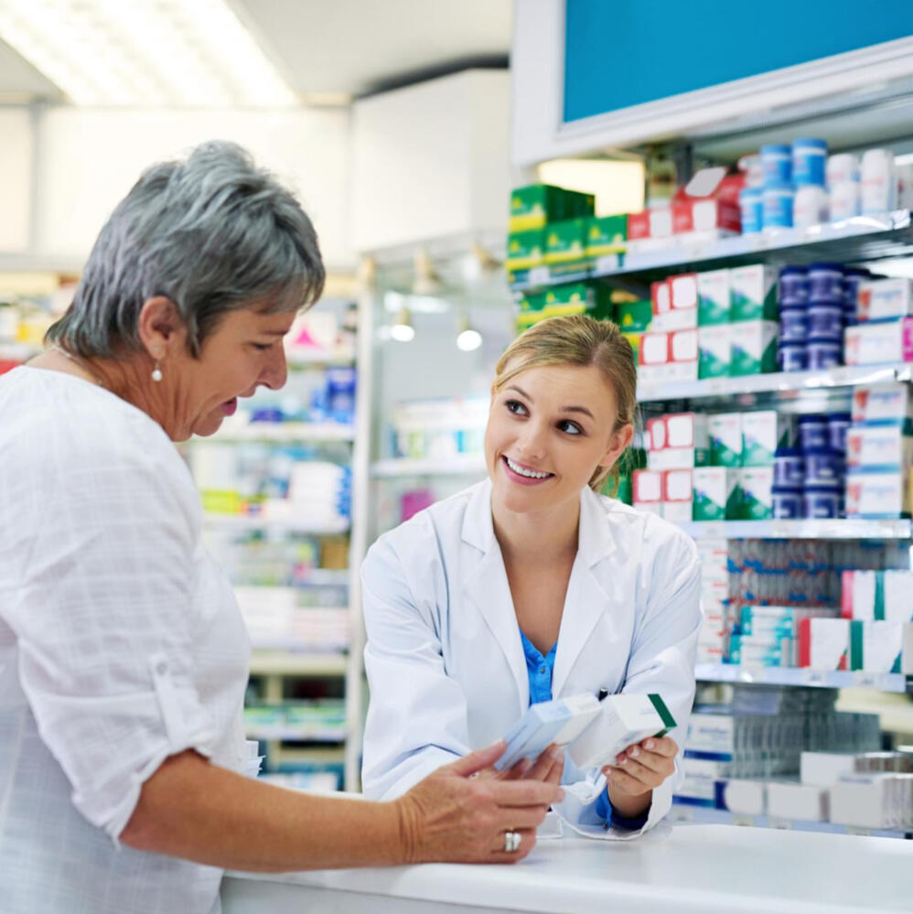 Pharmacist consulting patient